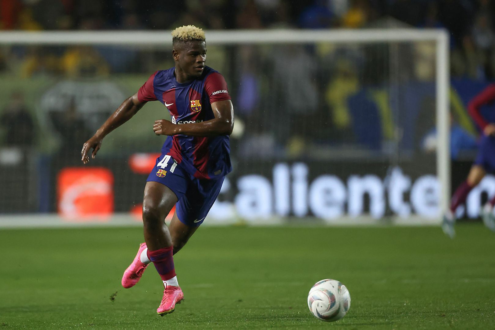 DALLAS, TEXAS - DECEMBER 21: Mikayil Faye #41 of Barcelona runs after the ball during the friendly match between FC Barcelona and Club America at Cotton Bowl on December 21, 2023 in Dallas, Texas.