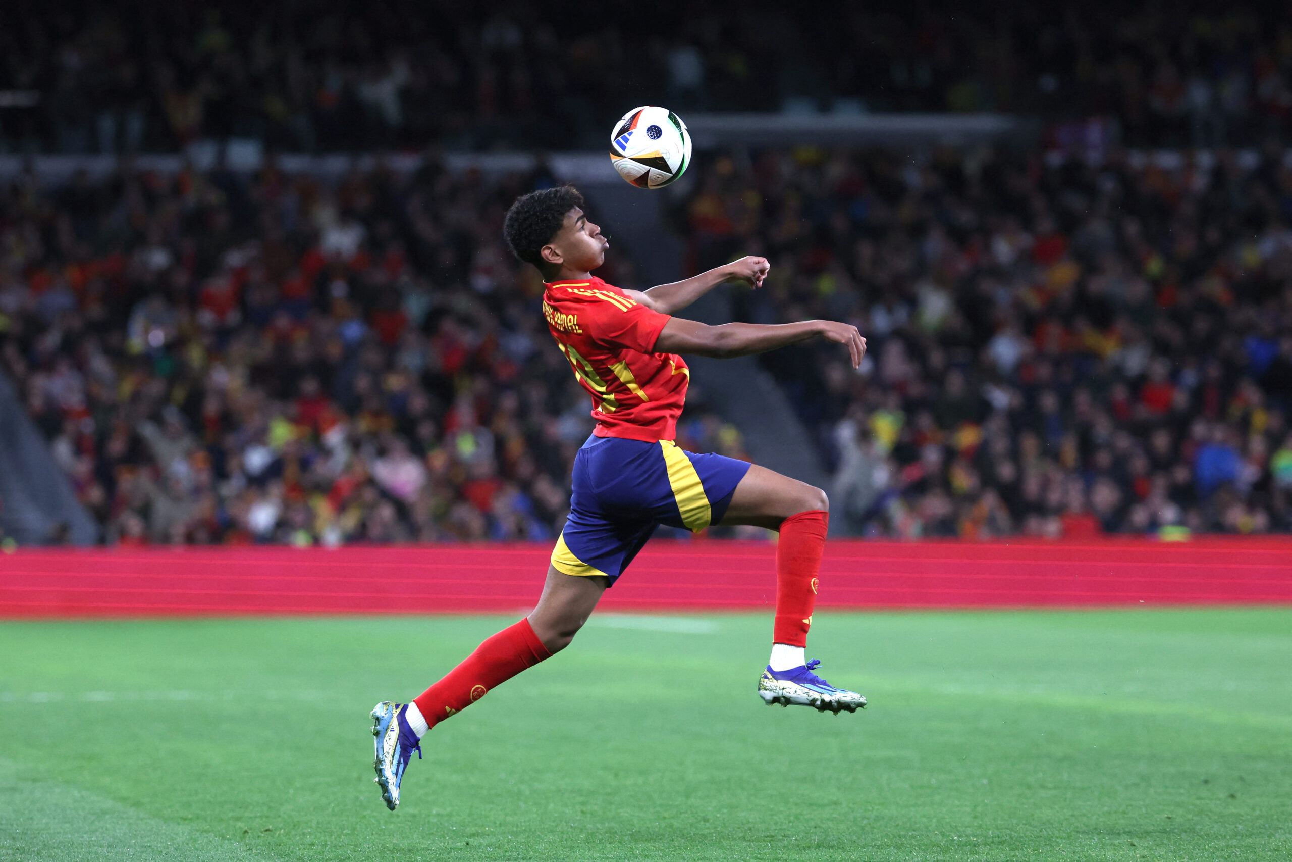 Spain's forward #19 Lamine Yamal controls the ball during the international friendly football match between Spain and Brazil at the Santiago Bernabeu stadium in Madrid, on March 26, 2024. Spain arranged a friendly against Brazil at the Santiago Bernabeu under the slogan "One Skin" to help combat racism.