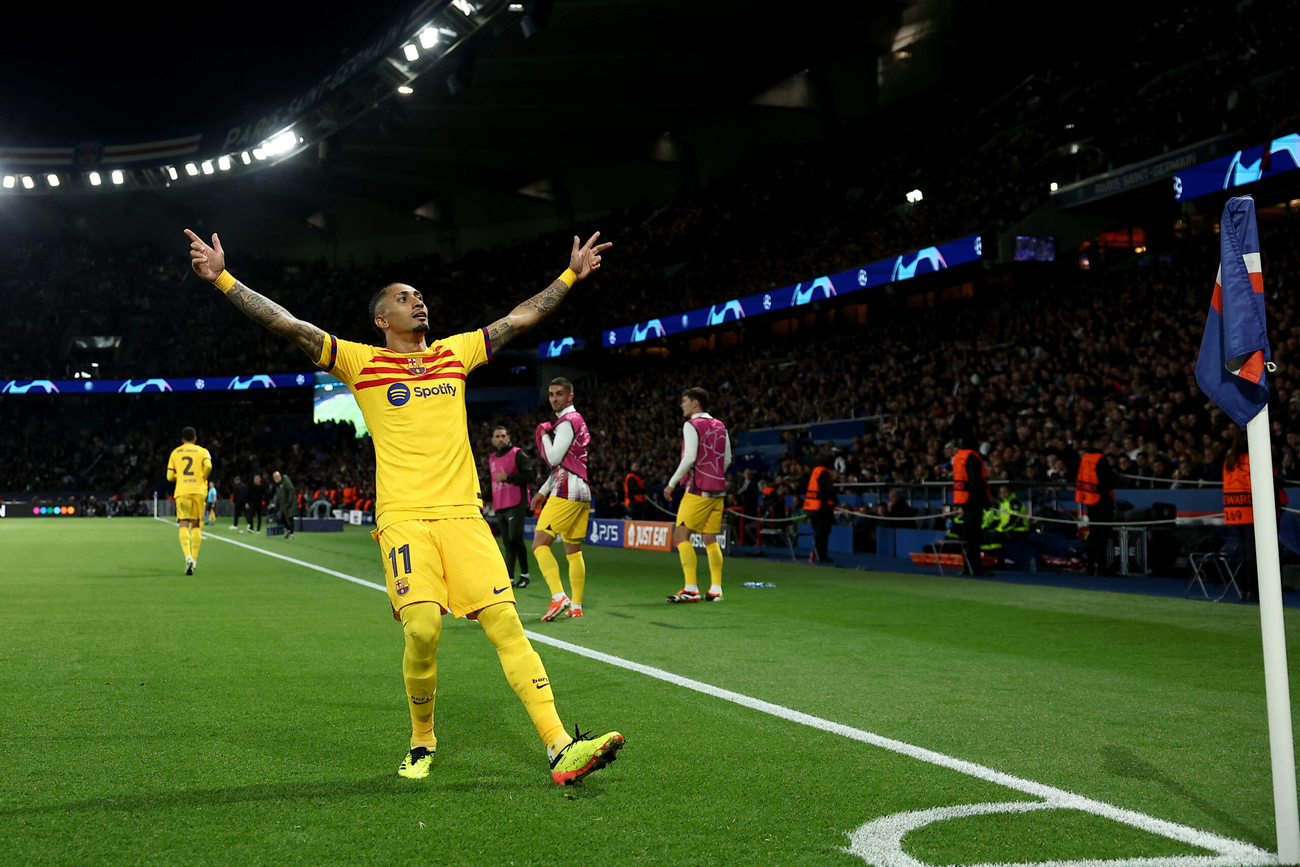 TOPSHOT - Barcelona's Brazilian forward #11 Raphinha celebrates after scoring Barcelona's second goal during the UEFA Champions League quarter final first leg football match between Paris Saint-Germain (PSG) and FC Barcelona at the Parc des Princes stadium in Paris on April 10, 2024.