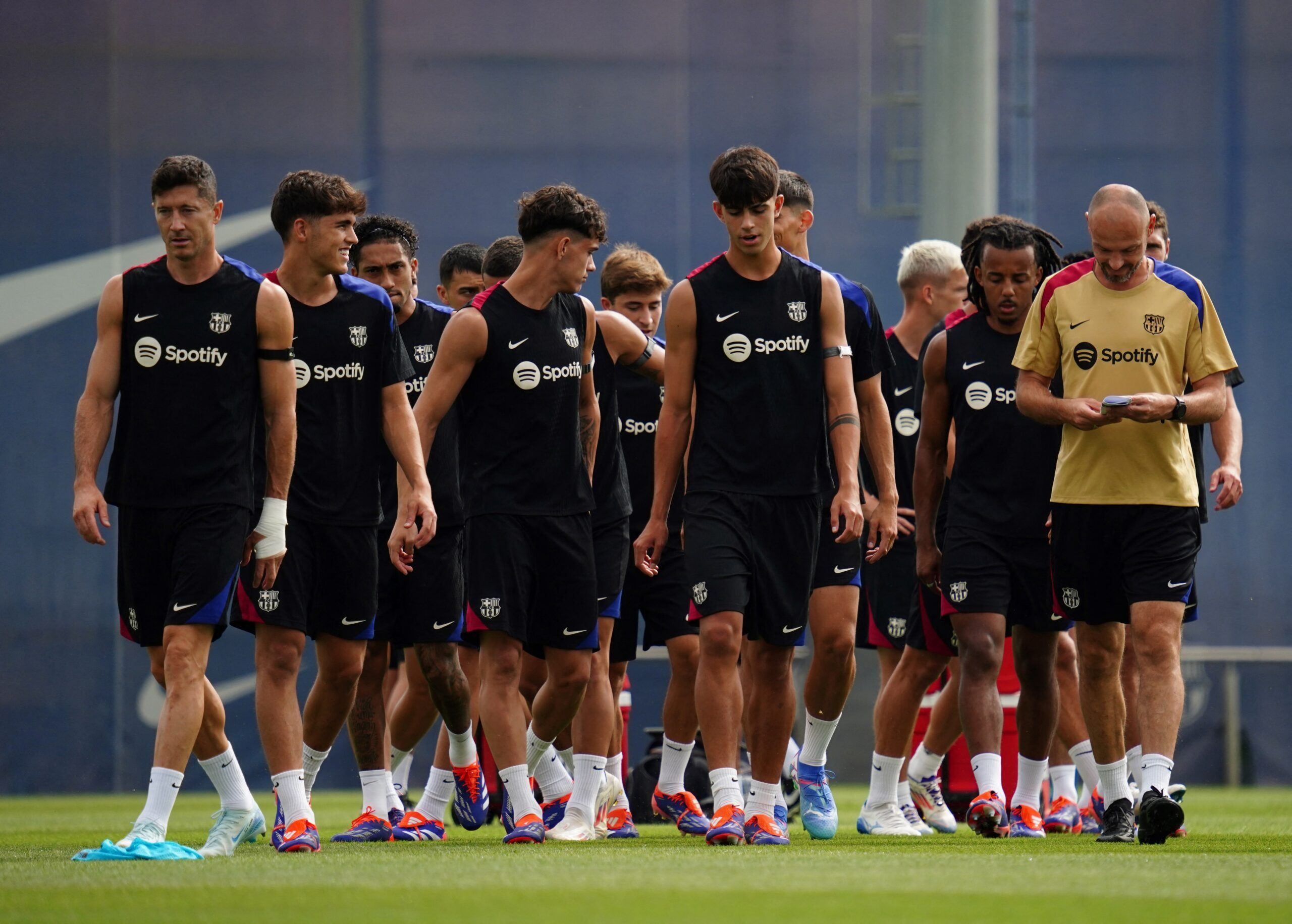 Barcelona's players take part in a training session ahead of the Spanish league football match between Valencia CF and FC Barcelona, at the Estadi Olimpic Lluis Companys in Barcelona on August 16, 2024.