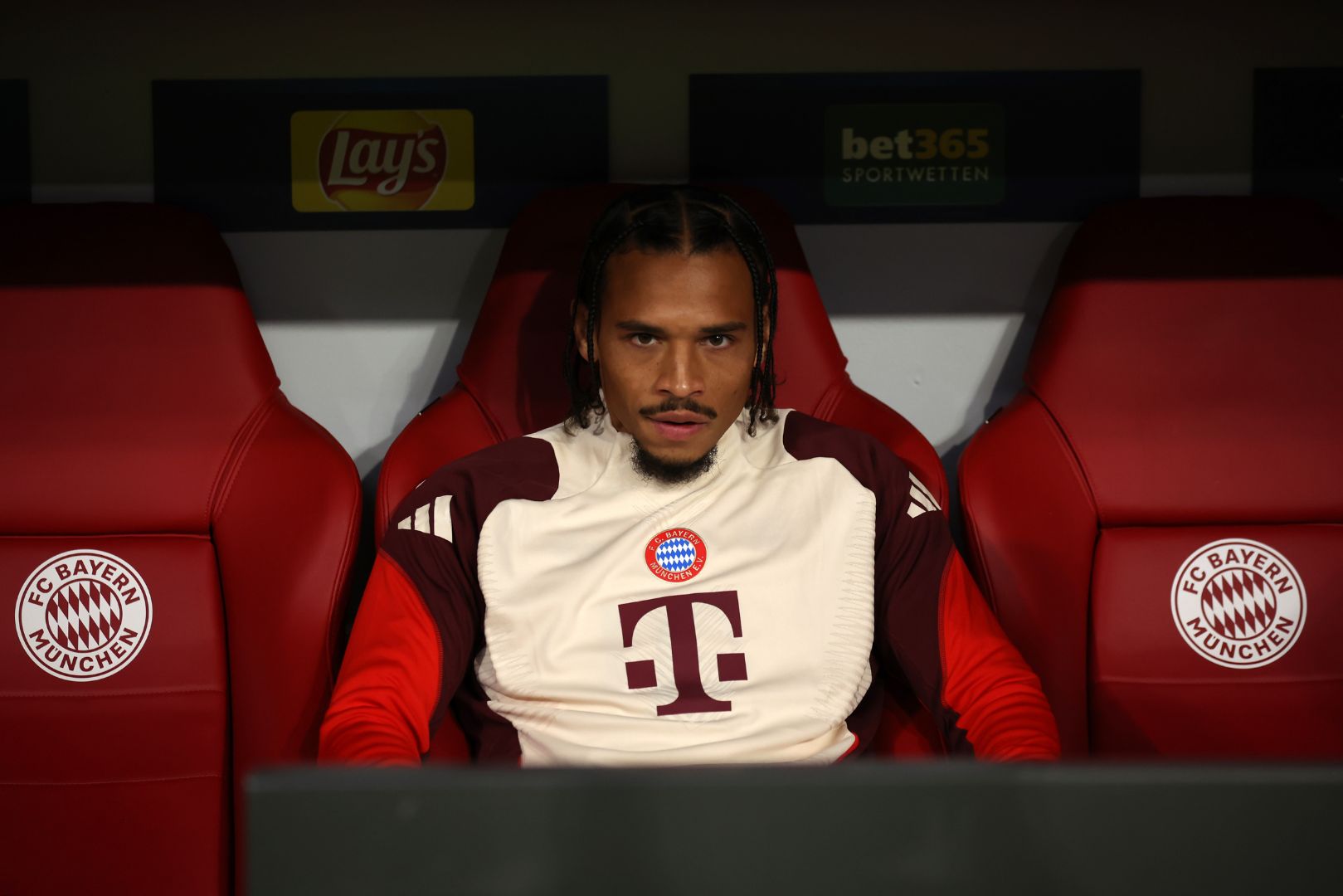 MUNICH, GERMANY - SEPTEMBER 17: Leroy Sane of Bayern Munich looks on from the bench during the UEFA Champions League 2024/25 League Phase MD1 match between FC Bayern München and GNK Dinamo at Football Arena Munich on September 17, 2024 in Munich, Germany.