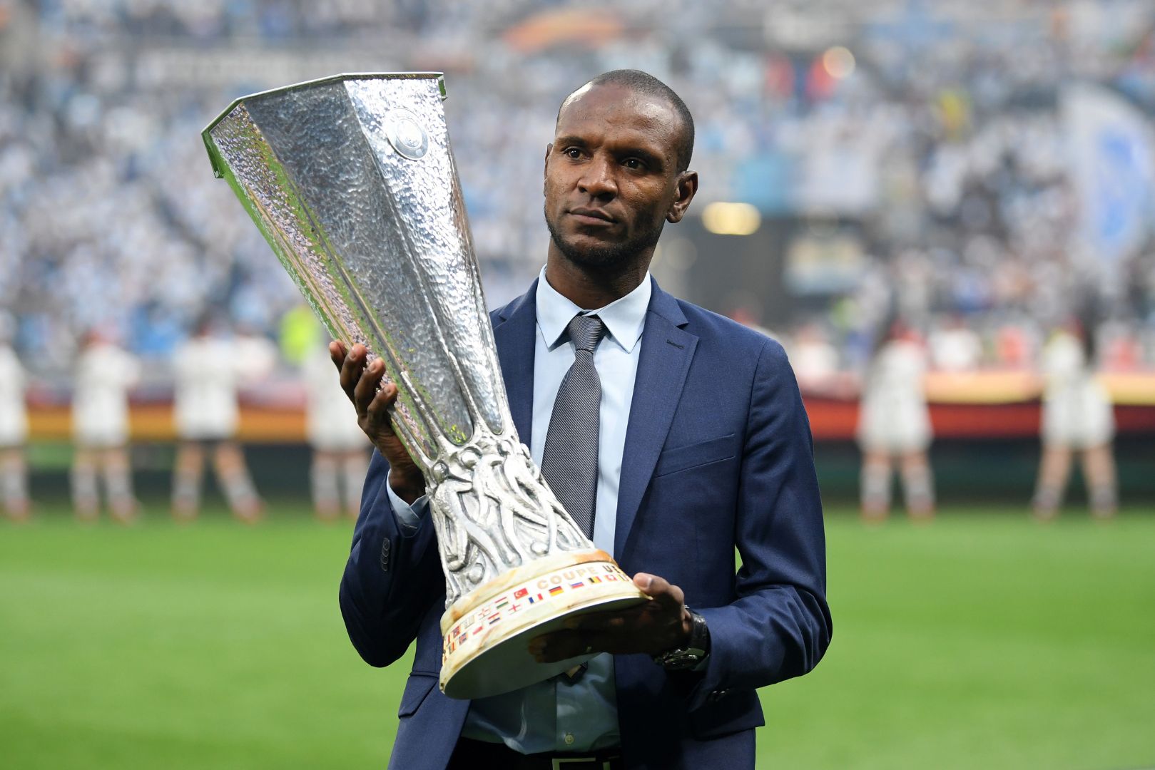 LYON, FRANCE - MAY 16: Eric Abidal walks out with the trophy ahead of the UEFA Europa League Final between Olympique de Marseille and Club Atletico de Madrid at Stade de Lyon on May 16, 2018 in Lyon, France.