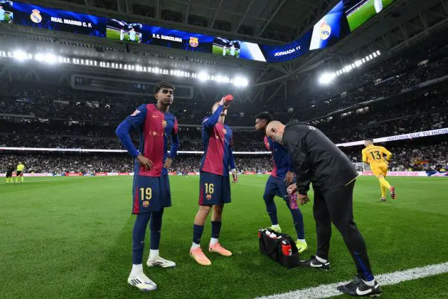 Lamine Yamal and Fermin Lopez of FC Barcelona react prior to the LaLiga match between Real Madrid CF and FC Barcelona at Estadio Santiago Bernabeu on October 26, 2024 in Madrid, Spain.
