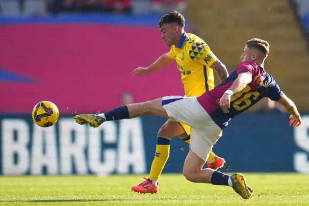 BARCELONA, SPAIN - NOVEMBER 30: Alberto Moleiro of UD Las Palmas is challenged by Fermin Lopez of FC Barcelona during the LaLiga match between FC Barcelona and UD Las Palmas at Estadi Olimpic Lluis Companys on November 30, 2024 in Barcelona, Spain.