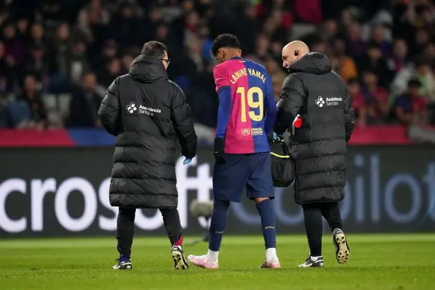 BARCELONA, SPAIN - DECEMBER 15: Lamine Yamal of FC Barcelona makes his way off the field after receiving medical treatement during the LaLiga match between FC Barcelona and CD Leganes at Estadi Olimpic Lluis Companys on December 15, 2024 in Barcelona, Spain.