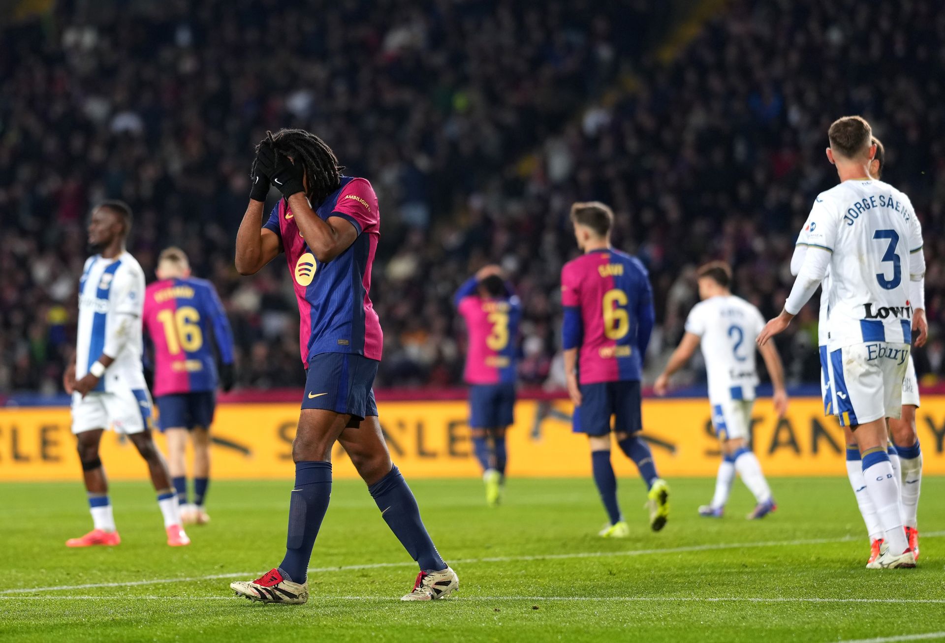 BARCELONA, SPAIN - DECEMBER 15: Jules Kounde of FC Barcelona reacts after a missed chance during the LaLiga match between FC Barcelona and CD Leganes at Estadi Olimpic Lluis Companys on December 15, 2024 in Barcelona, Spain.