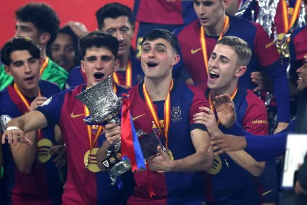 JEDDAH, SAUDI ARABIA - JANUARY 12: Pedri of FC Barcelona celebrates with the Supercopa de Espana winners' trophy during the trophy presentation after the Spanish Super Cup Final between Real Madrid and FC Barcelona at King Abdullah Sports City on January 12, 2025 in Jeddah, Saudi Arabia.