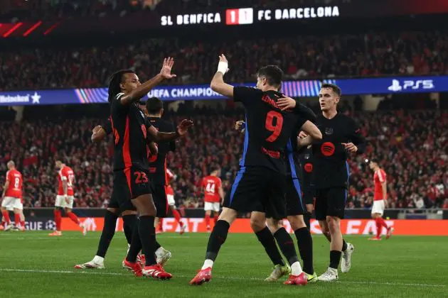 LISBON, PORTUGAL - JANUARY 21: Robert Lewandowski of FC Barcelona celebrates scoring his team's first goal with teammates during the UEFA Champions League 2024/25 League Phase MD7 match between SL Benfica and FC Barcelona at Estadio do SL Benfica on January 21, 2025 in Lisbon, Portugal.