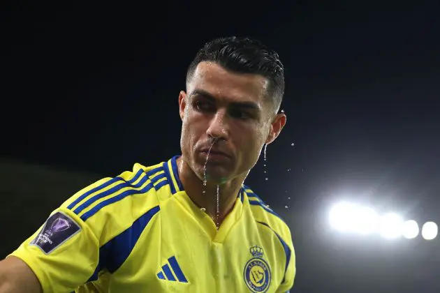 RIYADH, SAUDI ARABIA - NOVEMBER 05: Cristiano Ronaldo of Al-Nassr cools off with a bottle of water during the AFC Champions League Elite match between Al-Nassr FC and Al Ain FC at Al-Awaal Park on November 05, 2024 in Riyadh, Saudi Arabia.