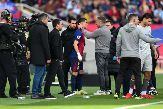 BARCELONA, SPAIN - FEBRUARY 02: Hansi Flick, Head Coach of FC Barcelona, speaks to Gavi of FC Barcelona during the LaLiga match between FC Barcelona and Deportivo Alaves at Estadi Olimpic Lluis Companys on February 02, 2025 in Barcelona, Spain.