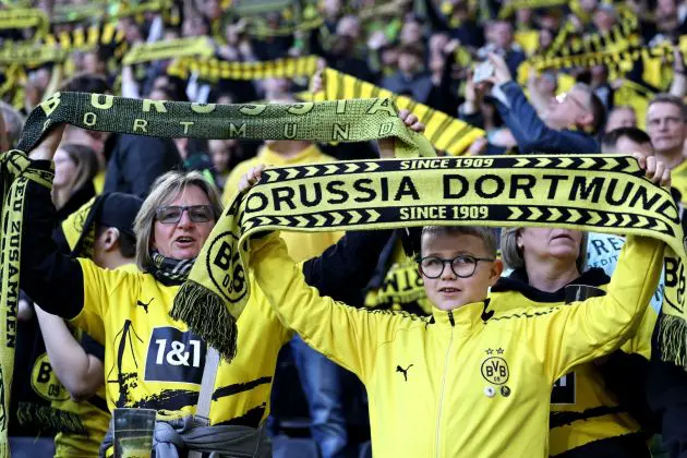DORTMUND, GERMANY - MARCH 08: Fans of Borussia Dortmund hold up scarfs in the stands prior to the Bundesliga match between Borussia Dortmund and FC Augsburg at the Signal Iduna Park on March 08, 2025 in Dortmund, Germany.