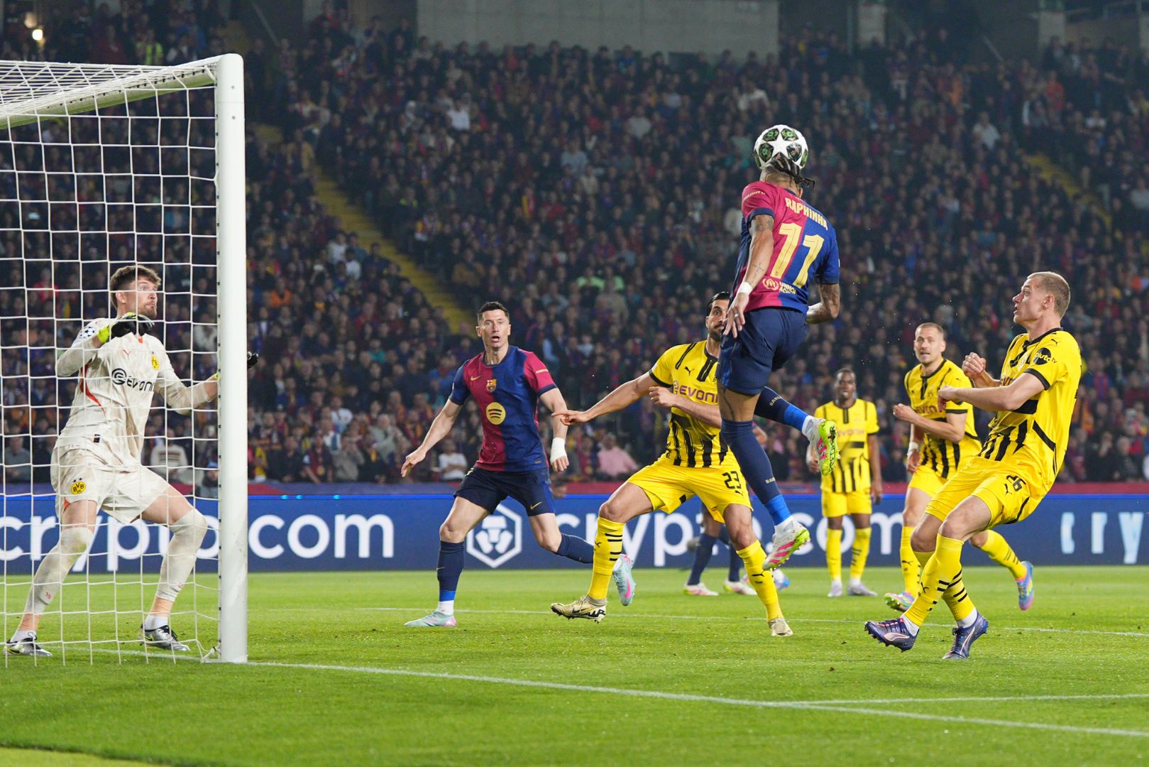 BARCELONA, SPAIN - APRIL 09: Raphinha of FC Barcelona heads the ball across goal before team mate Robert Lewandowski scores his team's second goal during the UEFA Champions League 2024/25 Quarter Final First Leg match between FC Barcelona and Borussia Dortmund at Estadi Olimpic Lluis Companys on April 09, 2025 in Barcelona, Spain.