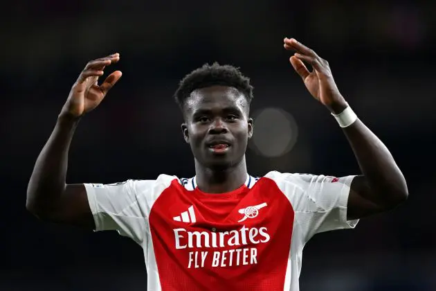 LONDON, ENGLAND - APRIL 08: Bukayo Saka of Arsenal encourages the fans during the UEFA Champions League 2024/25 Quarter Final First Leg match between Arsenal FC and Real Madrid C.F. at Emirates Stadium on April 08, 2025 in London, England.