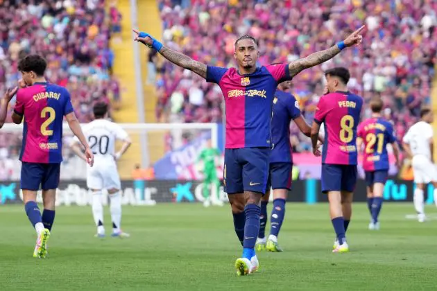 BARCELONA, SPAIN - MAY 11: Raphinha of FC Barcelona celebrates scoring his team's fourth goal during the LaLiga match between FC Barcelona and Real Madrid CF at Estadi Olimpic Lluis Companys on May 11, 2025 in Barcelona, Spain.