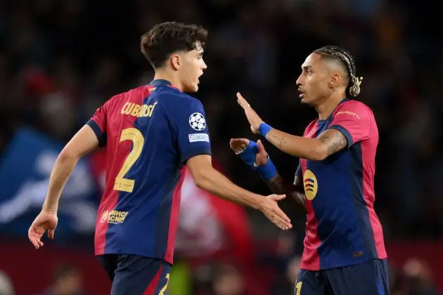 BARCELONA, SPAIN - APRIL 30: Raphinha of FC Barcelona (R) celebrates with team mate Pau Cubarsi after their team's third goal, an own goal scored by Yann Sommer of FC Internazionale (not pictured) during the UEFA Champions League 2024/25 Semi Final First Leg match between FC Barcelona and FC Internazionale Milano at Estadi Olimpic Lluis Companys on April 30, 2025 in Barcelona, Spain.