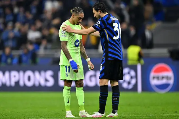 MILAN, ITALY - MAY 06: Raphinha of FC Barcelona is consoled by Matteo Darmian of FC Internazionale after his team's 4-3 defeat in the UEFA Champions League 2024/25 Semi Final Second Leg match between FC Internazionale Milano and FC Barcelona at Giuseppe Meazza Stadium on May 06, 2025 in Milan, Italy.