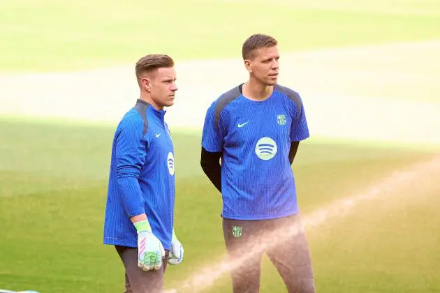 Wojciech Szczęsny and Marc Andre Ter Stegen of FC Barcelona look on during a training session.