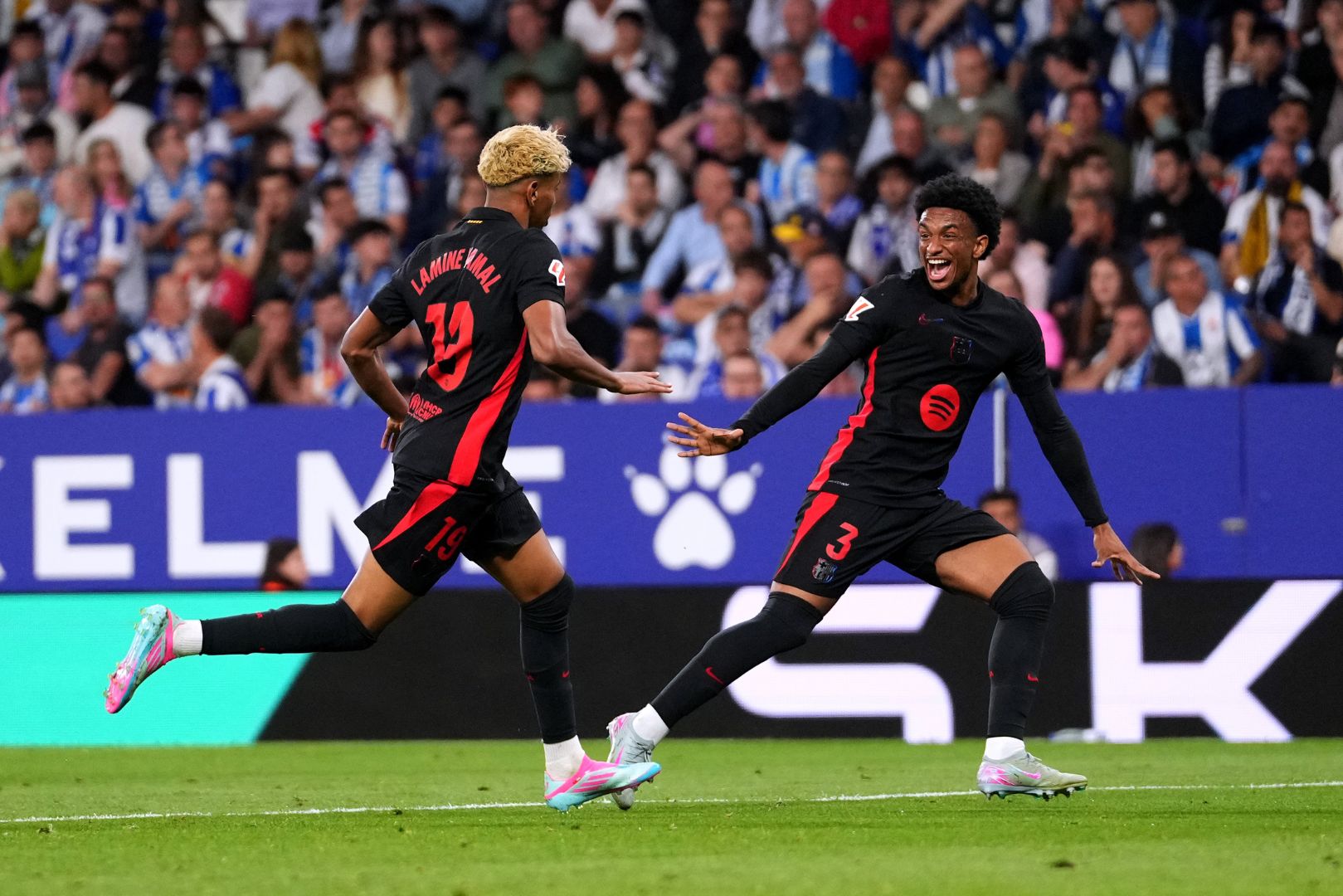 BARCELONA, SPAIN - MAY 15: Lamine Yamal of FC Barcelona celebrates scoring his team's first goal with teammate Alejandro Balde during the LaLiga match between RCD Espanyol de Barcelona and FC Barcelona at RCDE Stadium on May 15, 2025 in Barcelona, Spain.