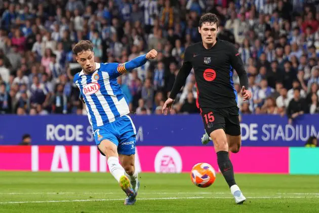 BARCELONA, SPAIN - MAY 15: Javi Puado of RCD Espanyol shoots whilst under pressure from Andreas Christensen of FC Barcelona during the LaLiga match between RCD Espanyol de Barcelona and FC Barcelona at RCDE Stadium on May 15, 2025 in Barcelona, Spain.