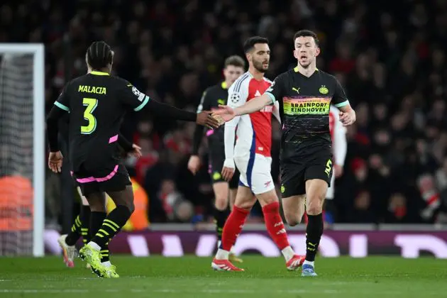 LONDON, ENGLAND - MARCH 12: Ivan Perisic of PSV Eindhoven celebrates scoring his team's first goal with teammate Tyrell Malacia during the UEFA Champions League 2024/25 Round of 16 Second Leg match between Arsenal FC and PSV at Arsenal Stadium on March 12, 2025 in London, England.