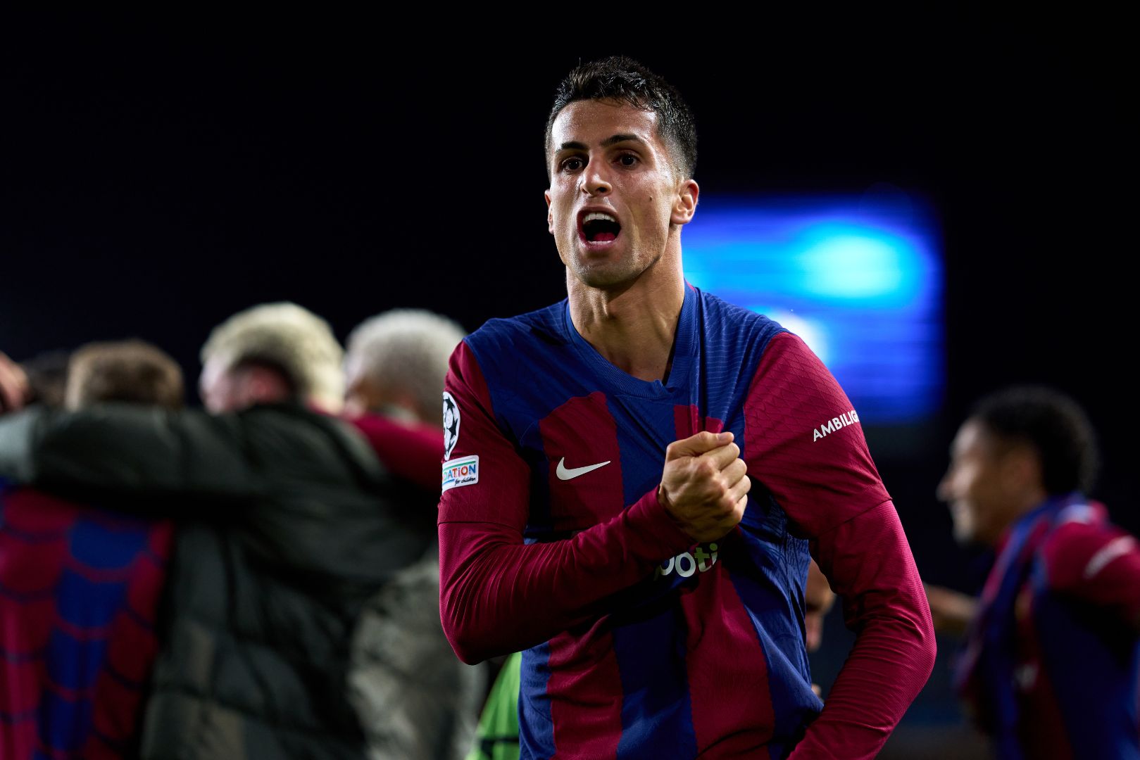 BARCELONA, SPAIN - MARCH 12: Joao Cancelo of FC Barcelona celebrates after his teammate Robert Lewandowski scored their team's third goal during the UEFA Champions League 2023/24 round of 16 second leg match between FC Barcelona and SSC Napoli at Estadi Olimpic Lluis Companys on March 12, 2024 in Barcelona, Spain.