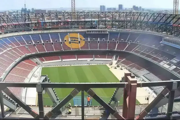 BARCELONA, SPAIN - August 01: Newly installed green pitch at Spotify Camp Nou viewed from the stands under clear skies, awaiting final field markings.