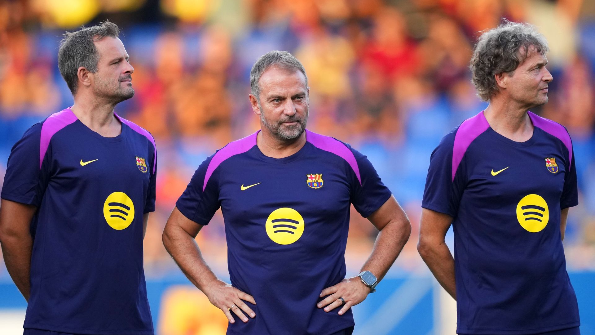 BARCELONA, SPAIN - AUGUST 10: Hansi Flick, Head Coach of FC Barcelona, and his staff look on during the Joan Gamper Trophy match between FC Barcelona and Como1907 at Estadi Johan Cruyff on August 10, 2025 in Barcelona, Spain.