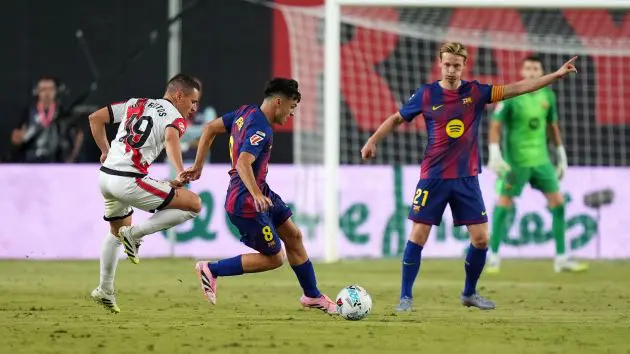 MADRID, SPAIN - AUGUST 31: Pedri of FC Barcelona being followed by Jorge de Frutos of Rayo Vallecano during the LaLiga EA Sports match between Rayo Vallecano de Madrid and FC Barcelona at Estadio de Vallecas on August 31, 2025 in Madrid, Spain.