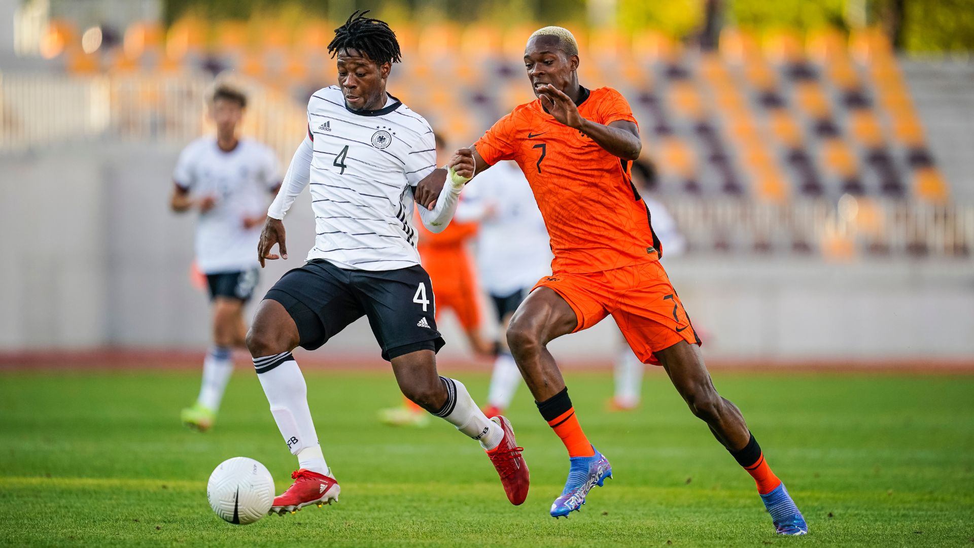 BANSKA BYSTRICA, SLOVAKIA - OCTOBER 12: Bright Arrey-Mbi of Germany U19 (L) in action against Emmanuel Esseh Emegha of Netherlands U19 during the Four Nations Tournament match between Germany U19 and Netherlands U19 at Stadion SNP on October 12, 2021 in Banska Bystrica, Slovakia.