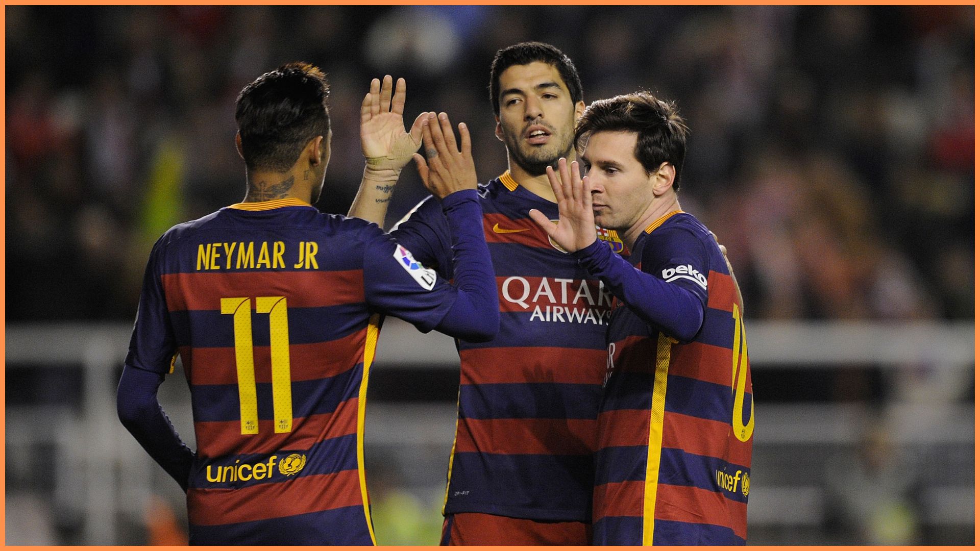 Lionel Messi of FC Barcelona celebrates with Neymar and Luis Suarez after scoring his 2nd goal during the La Liga match between Rayo Vallecano and FC Barcelona at Estadio de Vallecas.