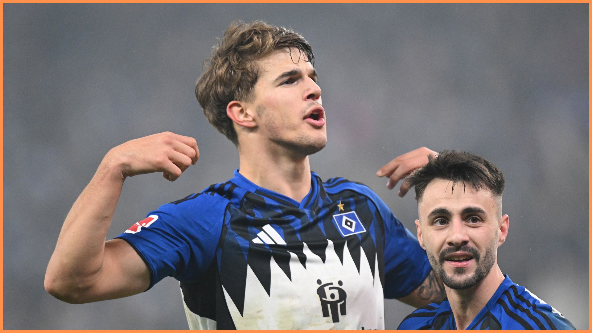 HAMBURG, GERMANY - DECEMBER 07: Luka Vuskovic of Hamburger SV (L) celebrates scoring his team's second goal with teammate Fabio Vieira (R) during the Bundesliga match between Hamburger SV and SV Werder Bremen at Volksparkstadion on December 07, 2025 in Hamburg, Germany.
