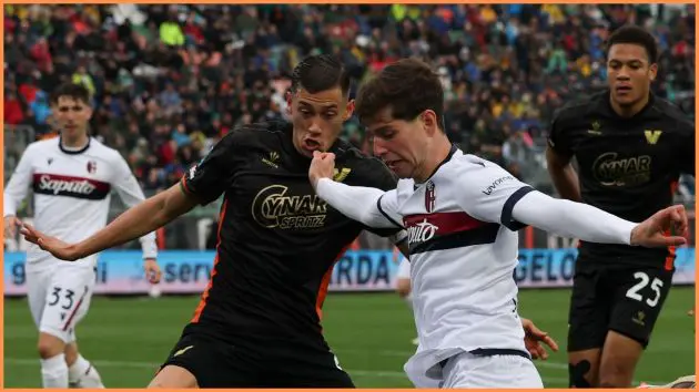 VENICE, ITALY - MARCH 29: Estanis Pedrola of Bologna crosses under pressure from Jay Idzes of Venezia during the Serie A match between Venezia and Bologna at Stadio Pier Luigi Penzo on March 29, 2025 in Venice, Italy.