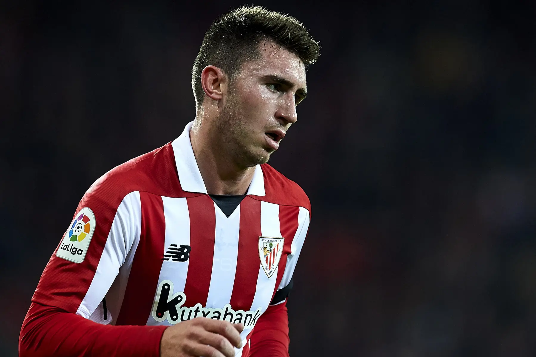 Aymeric Laporte wearing an Athletic Bilbao red and white striped jersey during a La Liga match