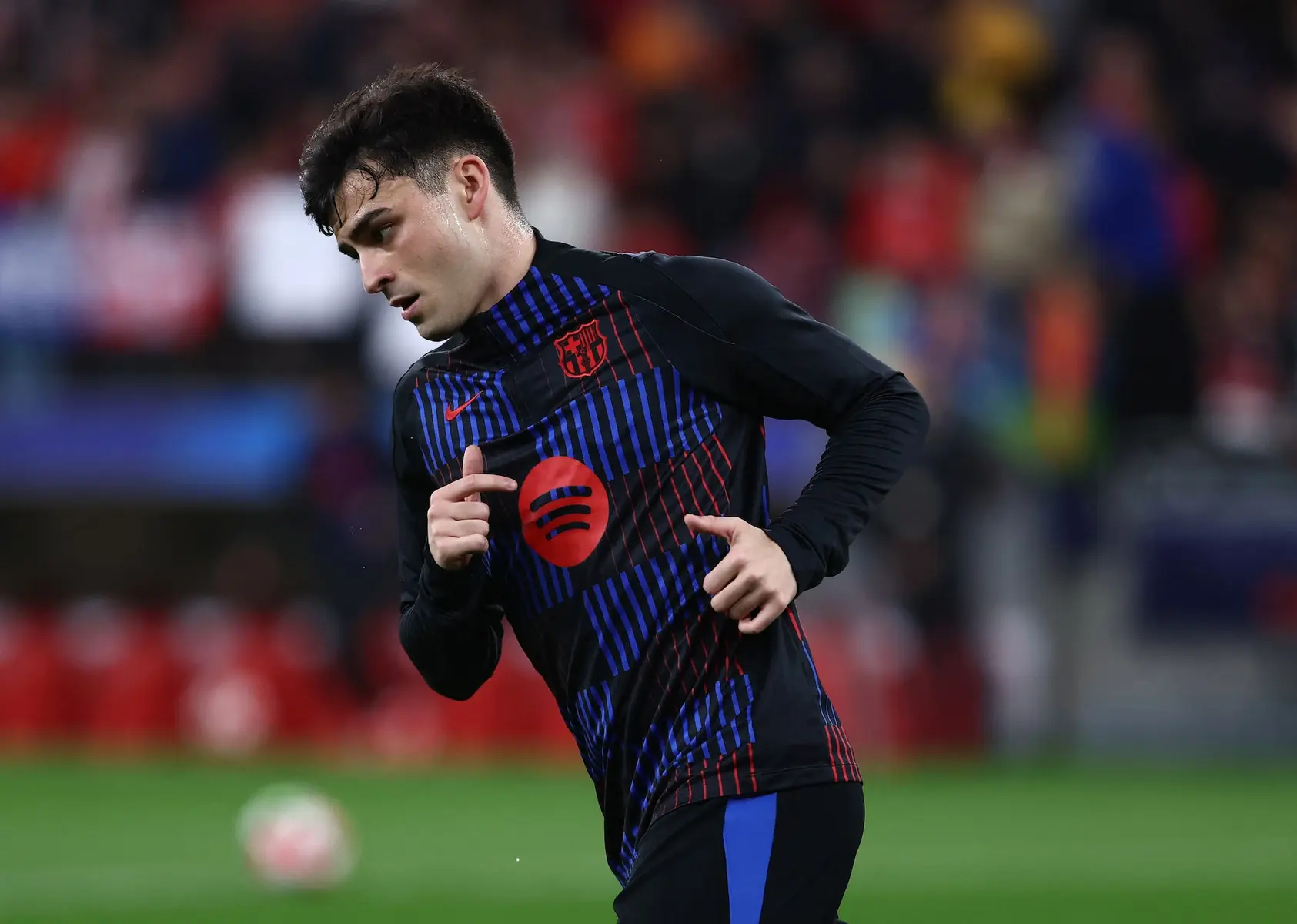Pedri wearing an FC Barcelona training kit during a football match