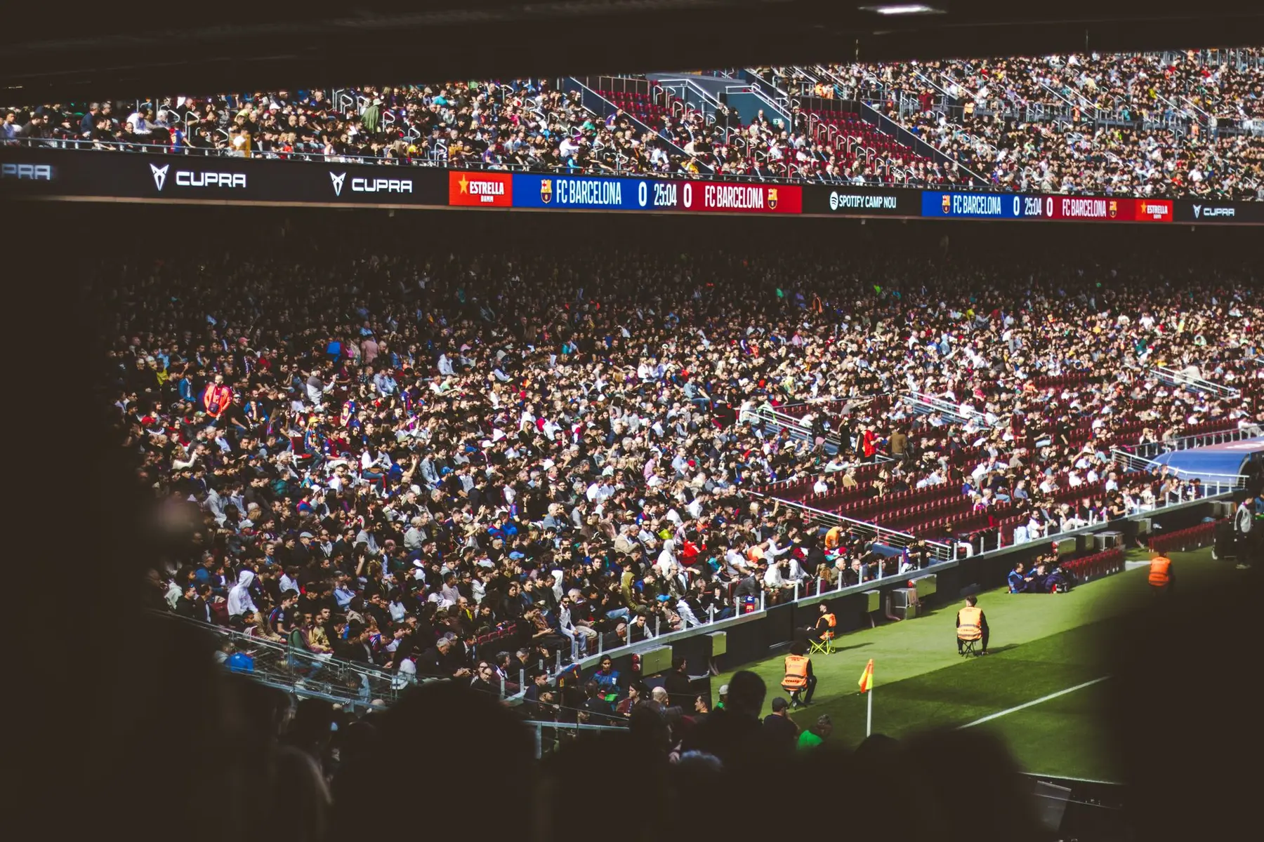 Crowded stands at Spotify Camp Nou stadium with FC Barcelona scoreboard visible