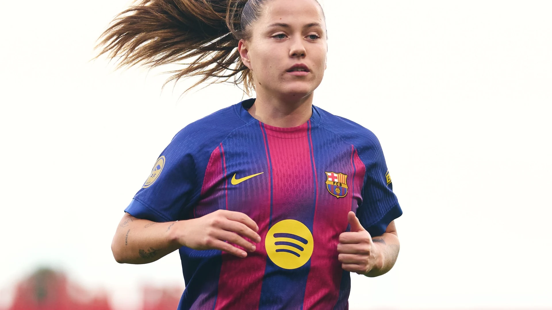 Claudia Pina in a Barcelona football kit during a match