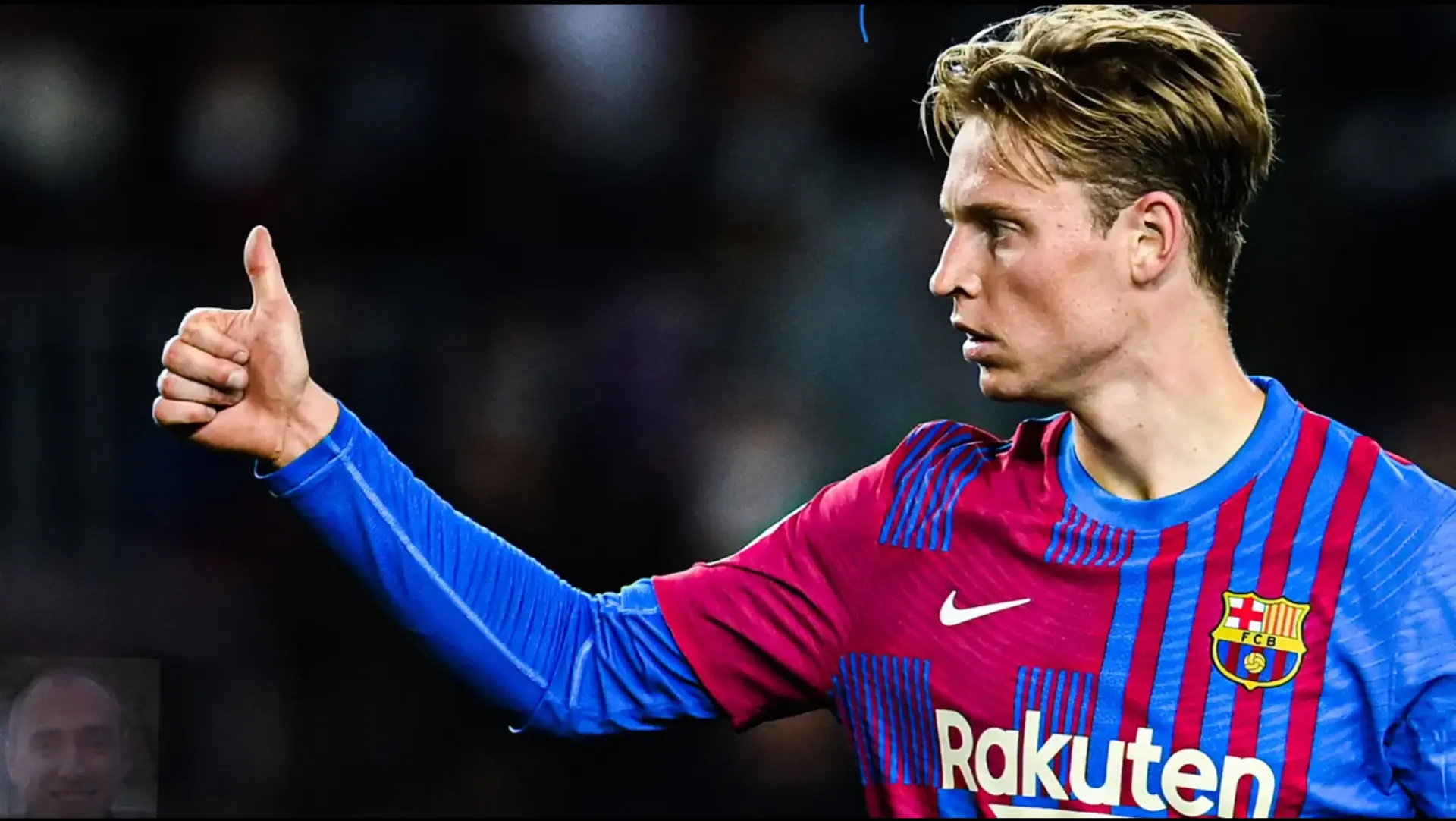 Frenkie de Jong giving a thumbs up while wearing a Barcelona kit on the pitch.